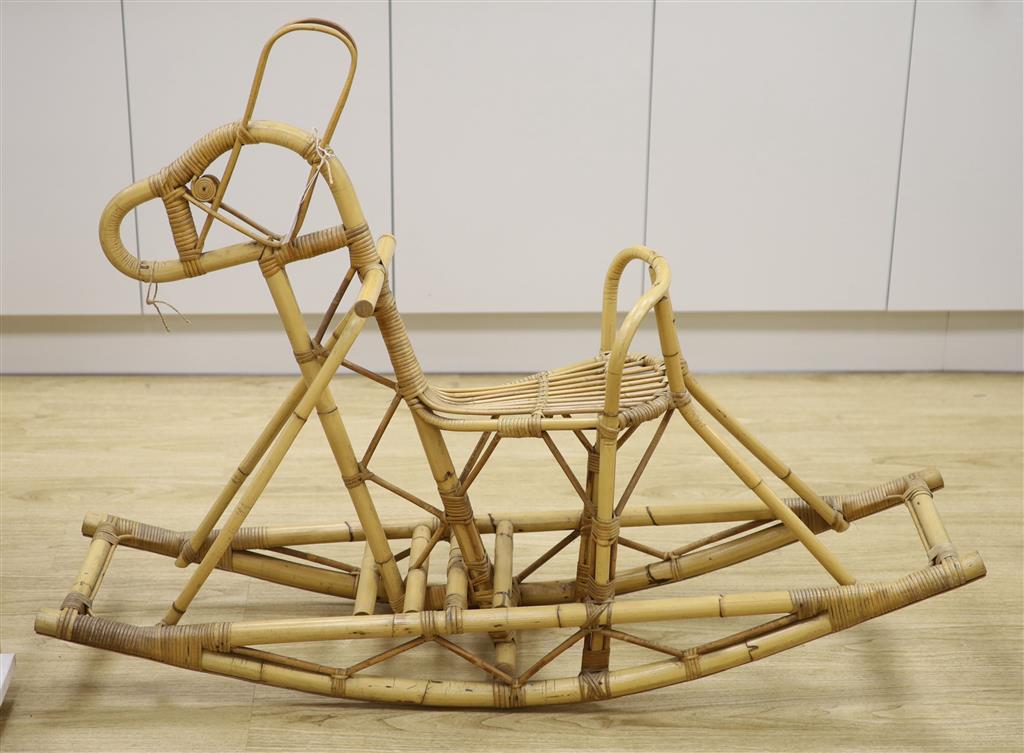 A bamboo and wicker rocking horse